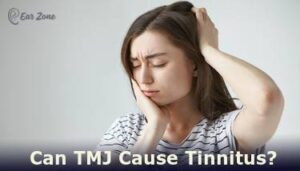 Featured image of a girl holding her head. Article on Can TMJ cause Tinnitus?